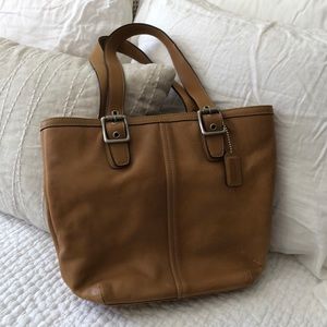 Coach camel colored leather purse.